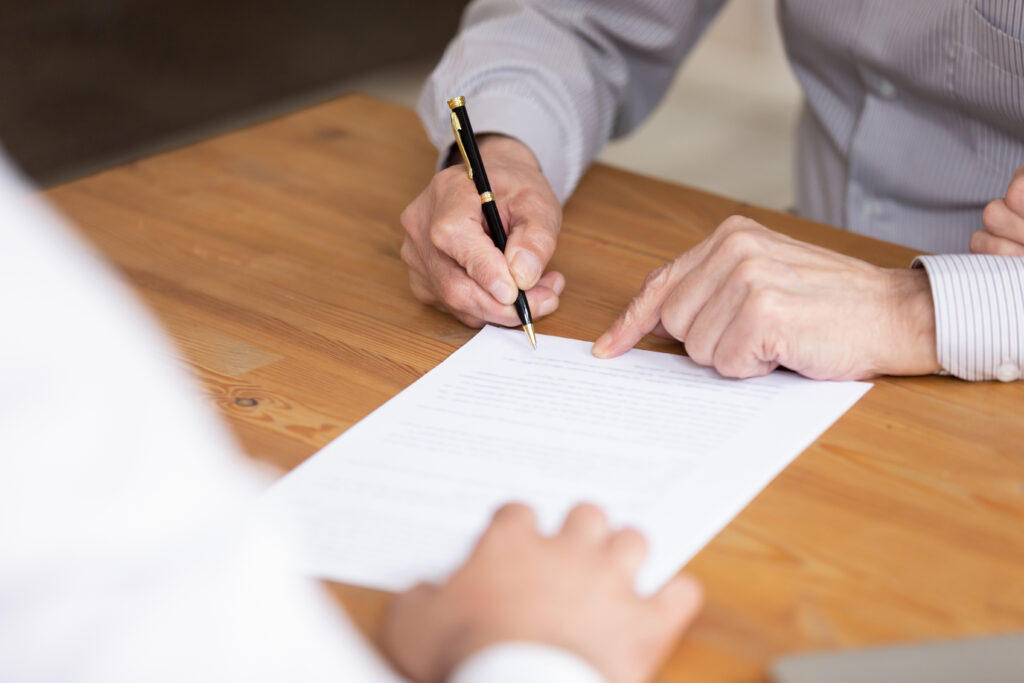 Close Up Elderly Businessman Hand Holding Pen, Put Signature On Paper